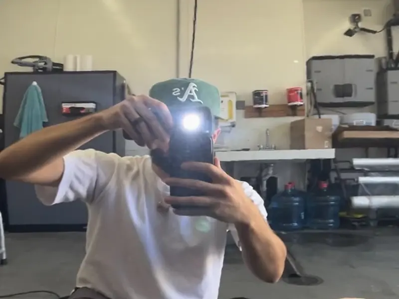Reflective black panel after paint correction