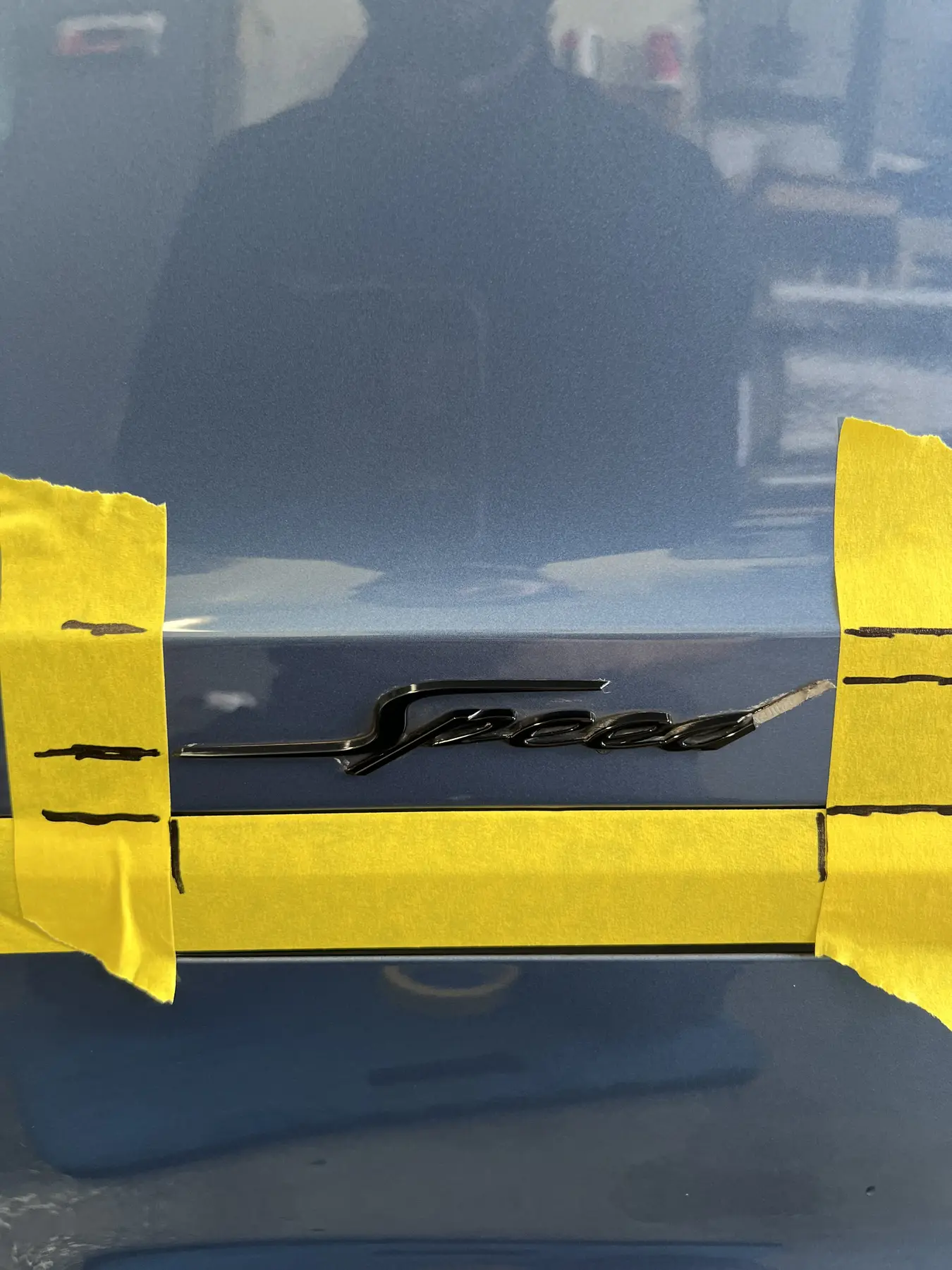 Porsche-script body panel before correction