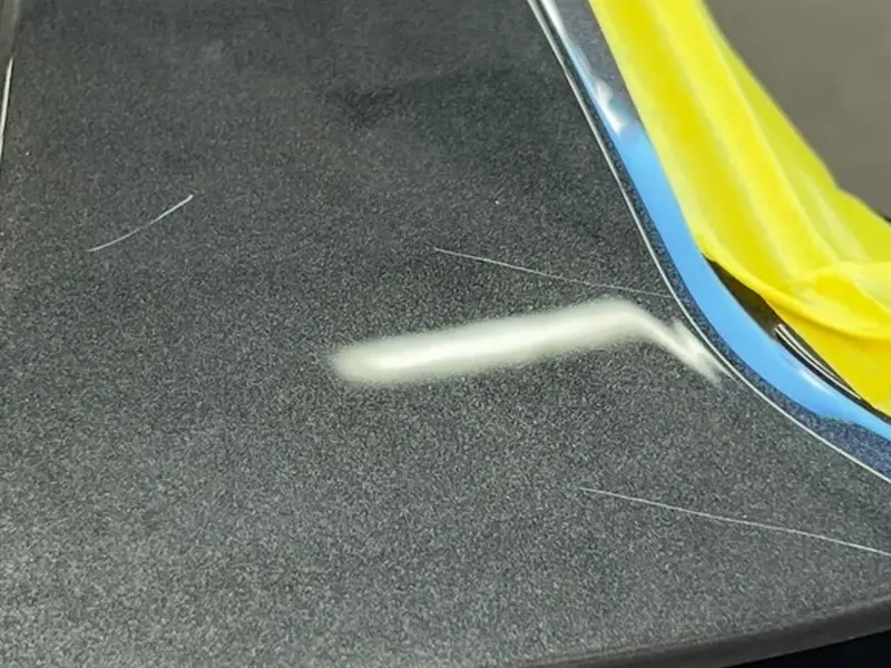 Wheel face with scratches before correction