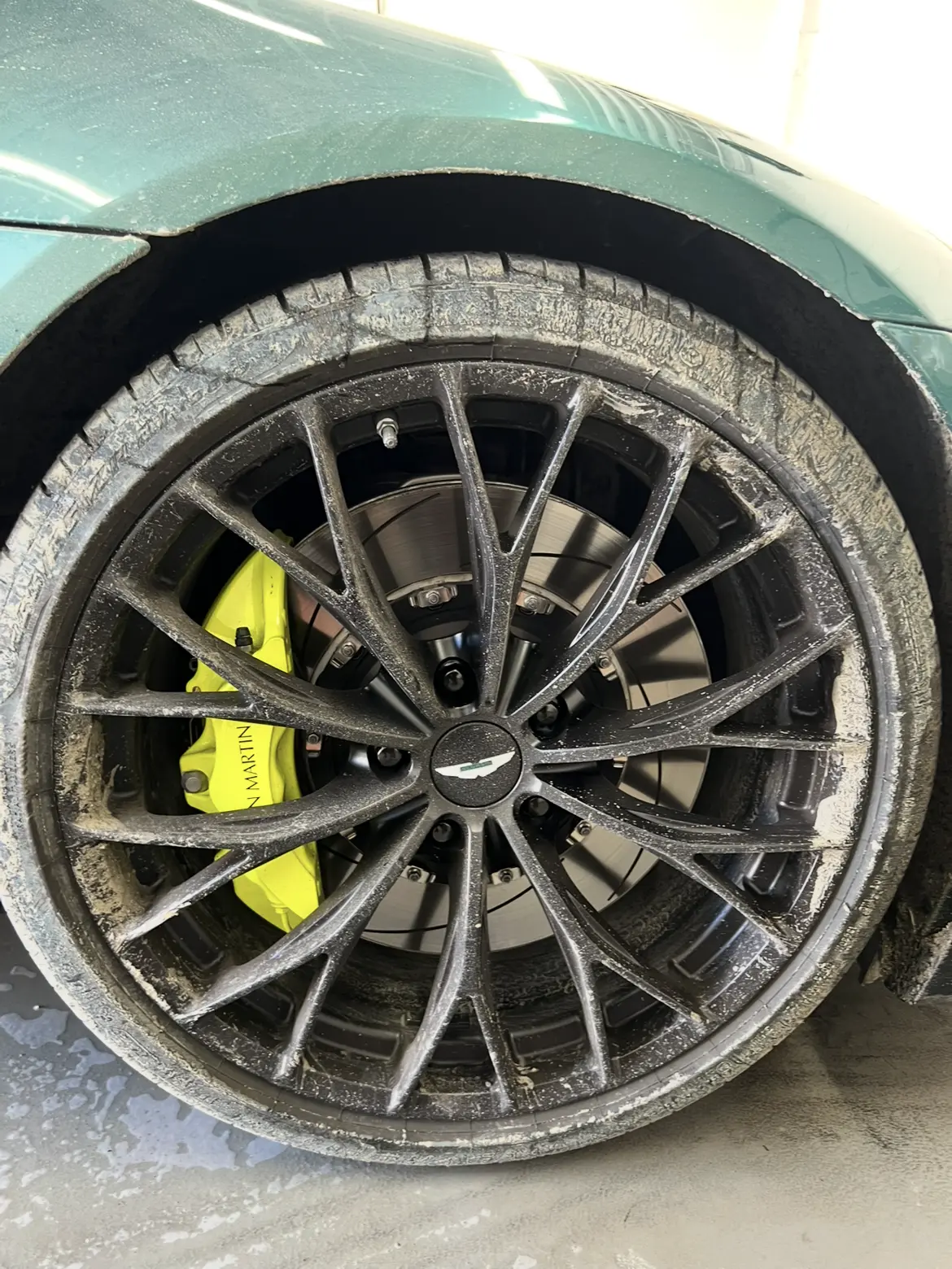 Aston Martin wheel before deep cleaning