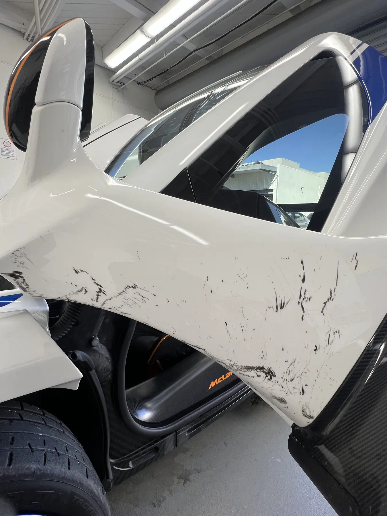 White door with scuff marks before detailing